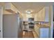 Bright kitchen featuring stainless steel appliances, granite countertops, and white cabinetry at 640 Waldon N Ave, Bartow, FL 33830