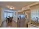 Kitchen/dining room with stainless steel appliances, table for six, granite counters, and white cabinets at 640 Waldon N Ave, Bartow, FL 33830