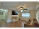 Cozy living room featuring tile floors, modern ceiling fan, and neutral color palette at 640 Waldon N Ave, Bartow, FL 33830