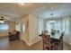 Open-concept living spaces with tile floors and a dark wood dining table for six at 640 Waldon N Ave, Bartow, FL 33830