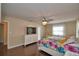 Bright main bedroom with wood floors, ceiling fan, and a view of the window at 640 Waldon N Ave, Bartow, FL 33830