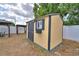Durable shed with window and dark trim in backyard near patio at 640 Waldon N Ave, Bartow, FL 33830