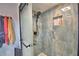 Shower featuring blue stone tiles, and a built-in soap niche at 640 Waldon N Ave, Bartow, FL 33830