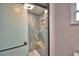 Modern shower featuring blue stone tiles, and a built-in soap niche at 640 Waldon N Ave, Bartow, FL 33830