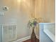 Stairwell with vase of flowers and white trim at 640 Waldon N Ave, Bartow, FL 33830