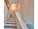 Upward view of the staircase with hardwood steps and white painted risers and railings at 640 Waldon N Ave, Bartow, FL 33830