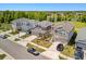 Aerial view of upscale homes in a well-planned community, with a serene lake and lush landscaping at 6520 Great Bear Dr, Lakeland, FL 33805