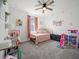 Bedroom featuring a bed, window, curtains, and playroom decor at 6520 Great Bear Dr, Lakeland, FL 33805