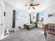 Bright bedroom with ceiling fan, twin bed, dual windows, and gray carpeting at 6520 Great Bear Dr, Lakeland, FL 33805
