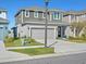 Two-story home with gray exterior, attached two car garage, and trimmed landscaping at 6520 Great Bear Dr, Lakeland, FL 33805