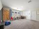 Large game room with climbing wall, foosball table, and playroom decor at 6520 Great Bear Dr, Lakeland, FL 33805