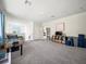 Upstairs game room featuring a foosball table, mounted television, and ample seating at 6520 Great Bear Dr, Lakeland, FL 33805