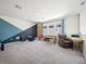 Game room featuring a sitting area, desk and an accent wall with foosball table at 6520 Great Bear Dr, Lakeland, FL 33805
