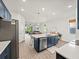 Modern kitchen features a center island, stainless steel appliances, and sleek cabinetry at 6520 Great Bear Dr, Lakeland, FL 33805