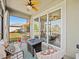 Inviting screened lanai features a fire pit table and comfortable seating, perfect for outdoor relaxation at 6520 Great Bear Dr, Lakeland, FL 33805