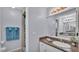 Updated bathroom with granite counters, and a tiled shower at 6735 Forestwood W Dr, Lakeland, FL 33811