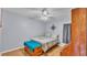 Cozy bedroom with natural light, wood floors and a charming decor at 6735 Forestwood W Dr, Lakeland, FL 33811