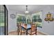 Cozy dining area with large windows offering views of the backyard and lots of light at 6735 Forestwood W Dr, Lakeland, FL 33811