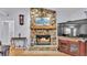 Close-up of a cozy stone fireplace with a wooden mantle and hearth, perfect for relaxing evenings at 6735 Forestwood W Dr, Lakeland, FL 33811