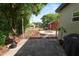 Landscaped backyard with a brick fire pit, grill and string lights creating a cozy outdoor retreat at 705 W Park St, Lakeland, FL 33803