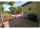 Landscaped backyard with a brick fire pit and a grill area, creating a perfect outdoor living space at 705 W Park St, Lakeland, FL 33803