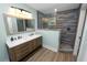 Stylish bathroom featuring a double sink vanity and a beautifully tiled shower area at 705 W Park St, Lakeland, FL 33803
