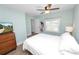 Comfortable bedroom featuring a large window, stylish decor, and wood flooring at 705 W Park St, Lakeland, FL 33803