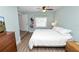 Comfortable bedroom featuring a large window, stylish decor, and wood flooring at 705 W Park St, Lakeland, FL 33803