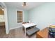 Bright dining room with stylish light fixture and seating for four at 705 W Park St, Lakeland, FL 33803
