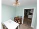 Comfortable dining area with view to laundry room and kitchen at 705 W Park St, Lakeland, FL 33803