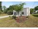 Charming one-story home boasts a well-maintained lawn, landscaping, and a welcoming entrance at 705 W Park St, Lakeland, FL 33803