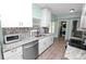 Updated kitchen with modern sink, countertops and stainless appliances at 705 W Park St, Lakeland, FL 33803