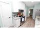 Cozy kitchen featuring an oven, microwave and stainless steel appliances at 705 W Park St, Lakeland, FL 33803