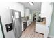 Beautiful kitchen features stainless steel appliances and white cabinets at 705 W Park St, Lakeland, FL 33803