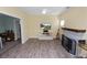 Cozy living room featuring a decorative fireplace and an entertainment center at 705 W Park St, Lakeland, FL 33803