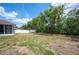 Spacious backyard with ample green space and mature trees, offering privacy and a natural setting at 7088 Remington Oaks Loop, Lakeland, FL 33810