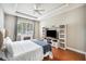 Bedroom with decorative trey ceiling, and built-in media center at 7088 Remington Oaks Loop, Lakeland, FL 33810