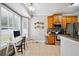 Bright kitchen nook featuring a desk, and modern stainless steel appliances at 7088 Remington Oaks Loop, Lakeland, FL 33810