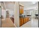 Bright kitchen with wood cabinets, stainless steel appliances, and an adjacent breakfast nook at 7088 Remington Oaks Loop, Lakeland, FL 33810