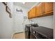 A laundry room featuring a washer, a dryer, cabinets, and 