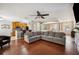 Spacious living room with open access to the kitchen and dining area for seamless entertaining at 7088 Remington Oaks Loop, Lakeland, FL 33810