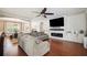Comfortable living room featuring a modern fireplace, shiplap wall, and cozy seating area at 7088 Remington Oaks Loop, Lakeland, FL 33810