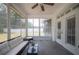 A patio area featuring a ceiling fan, a small coffee table, and a couch with a white cushion at 7088 Remington Oaks Loop, Lakeland, FL 33810