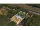 Aerial view showing property lines near the highway, surrounded by lush greenery at 7208 Thomas Jefferson Cir, Bartow, FL 33830