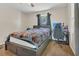 Comfortable bedroom featuring wood flooring, and natural light from the window at 7208 Thomas Jefferson Cir, Bartow, FL 33830