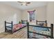 Shared bedroom with wood floors and ceiling fan at 7208 Thomas Jefferson Cir, Bartow, FL 33830