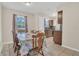 Inviting dining area featuring a traditional wooden table set and a window with natural light at 7208 Thomas Jefferson Cir, Bartow, FL 33830