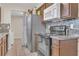 A view of the kitchen highlighting appliances and the mosaic backsplash at 7208 Thomas Jefferson Cir, Bartow, FL 33830
