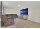 Cozy living room with plush sofa and tile flooring, perfect for relaxing evenings at 7208 Thomas Jefferson Cir, Bartow, FL 33830