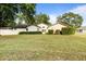 Charming single-story home with well-manicured lawn, landscaping, and white trim at 781 Bryson Loop, Lakeland, FL 33809